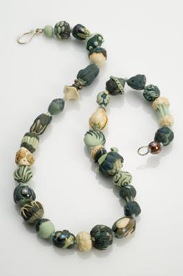 Hand-formed beads strung on silk, hand-formed sterling clasp